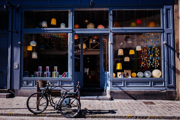 A bike parked in front of a store